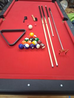 Like new 7 ft folding $670 pool table with extra sticks, balls, and more
