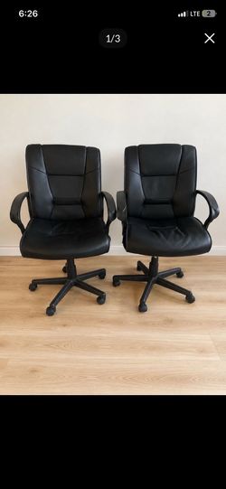 3 black leather chairs