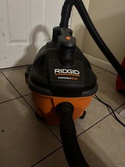 Rigid portable vacuum