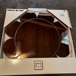 Flower mirror. Slight pink hue to it