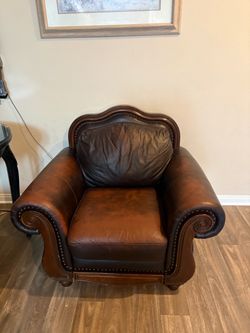 leather and wood couch and chair