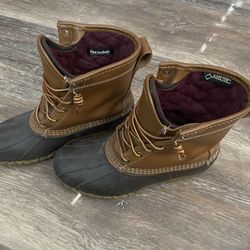 Classic L.L. Bean “Bean Boots” with waterproof rubber bottoms and leather uppers, lined with 3M Thinsulate for extra warmth in cold weather. Made in M