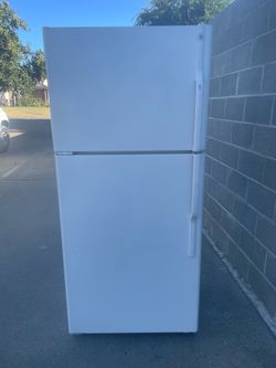 GE top and bottom refrigerator for $170.  Dimensions are 28Wx30Dx67H. Pick up only.