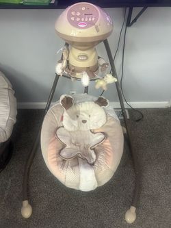 Fisher-Price My Little Snugapuppy Cradle 'n Swing featuring a plush puppy