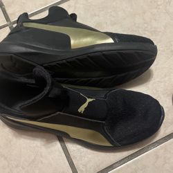 Black And Gold Pumas Size8 1/2