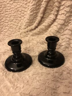 A pair of black candlesticks