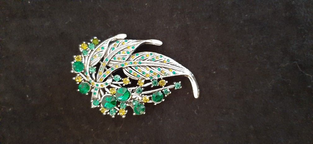 Leaf brooch with green & yellow tone stones