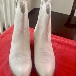 Woman’s Cowboy Boot And Hat