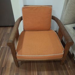 Low Wood Frame With Orange Cushings Chair
