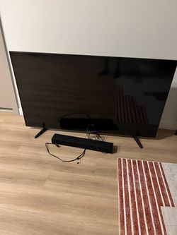 Large Flat Screen TV with Soundbar