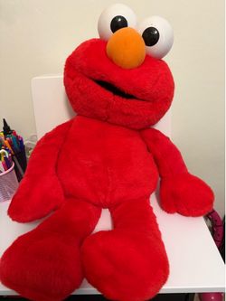 Large Elmo and Mickey Mouse stuffed dolls
