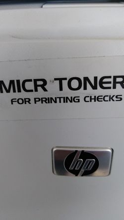 Printer with magnetic toner for printing checks
