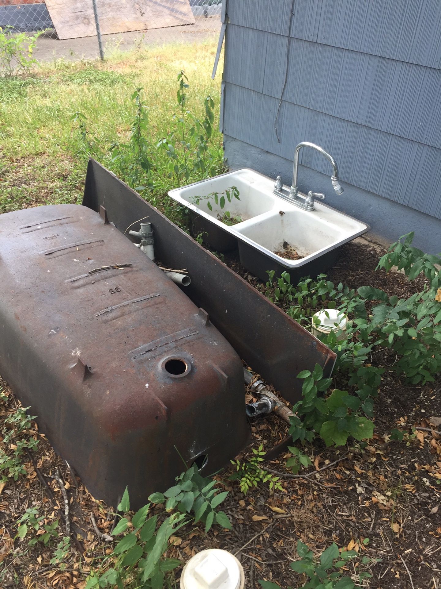 Cast Iron Heavy tub, kitchen sink, two pedestal sinks, two bathroom