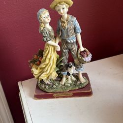 vintage Capodimonte porcelain figurine set, possibly from the 1970s, featuring a boy and a girl with a small dog