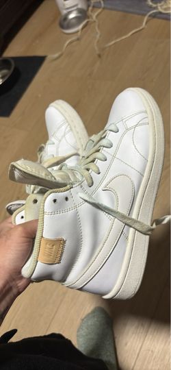 White leather nike shoes