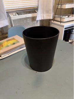 Small metal trash can