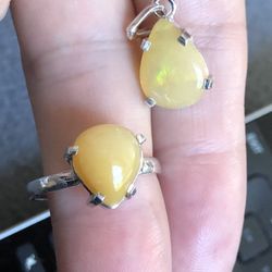Set Of  Tear Drop Shape Fire Opal hand Made Silver Ring size 8 And Pendant . New Never Been Used . Please Look At My Profile To See All Items Thanks 