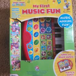 Mickey Mouse portable keyboard and music books 