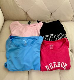 Set of 4 women’s active wear shirts