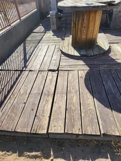 wood pallets and a spool used as a table