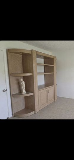 Solid entertainment center with sliding doors *detached)