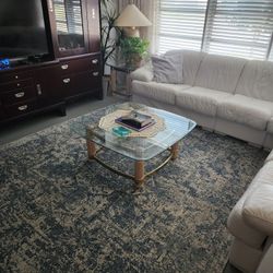 White Leather sectional Couch...2 end tables and coffee table.