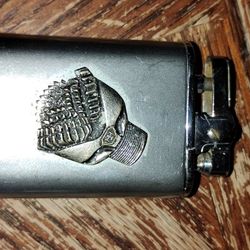vintage Howard Hughes Tool Company musical lighter from the 1950