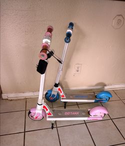 2-Used Go Trax GT-  GKS PLUS Scooters blue and pink (ONLY 1 Charger)