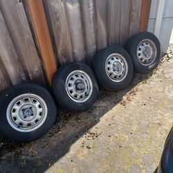 13 inch 4x100 honda steel wheels with tires