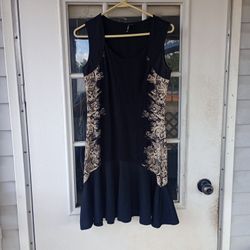 Smash! Sz XSmall Black dress with designs on the sides 