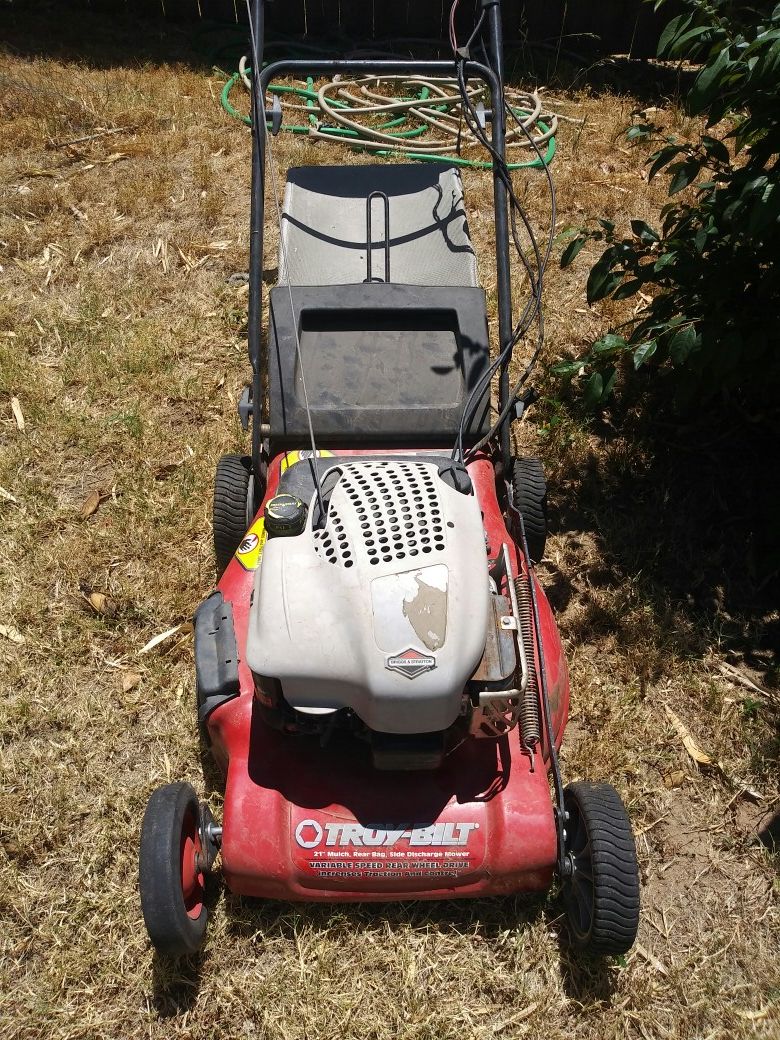 Troy built self driven lawn mower needs help wheels are locked for sale $30,
