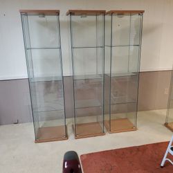 Three Glass And Wood Display Cases With Doors And Light