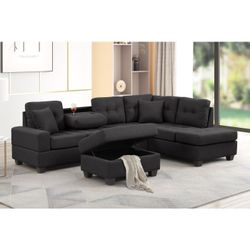 Brand new black linen reversible sectional + storage ottoman (Sectional Size: 104.92 x 72.83 x 34.25 in. H Ottoman Size: 31.89 x 22.83 x 17.91 in. H)