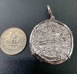 Silver coin pendant