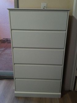White Dresser. Length: 27.5 in. Height: 48 in