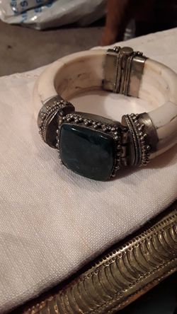 Camel bone with large blue stone and brass