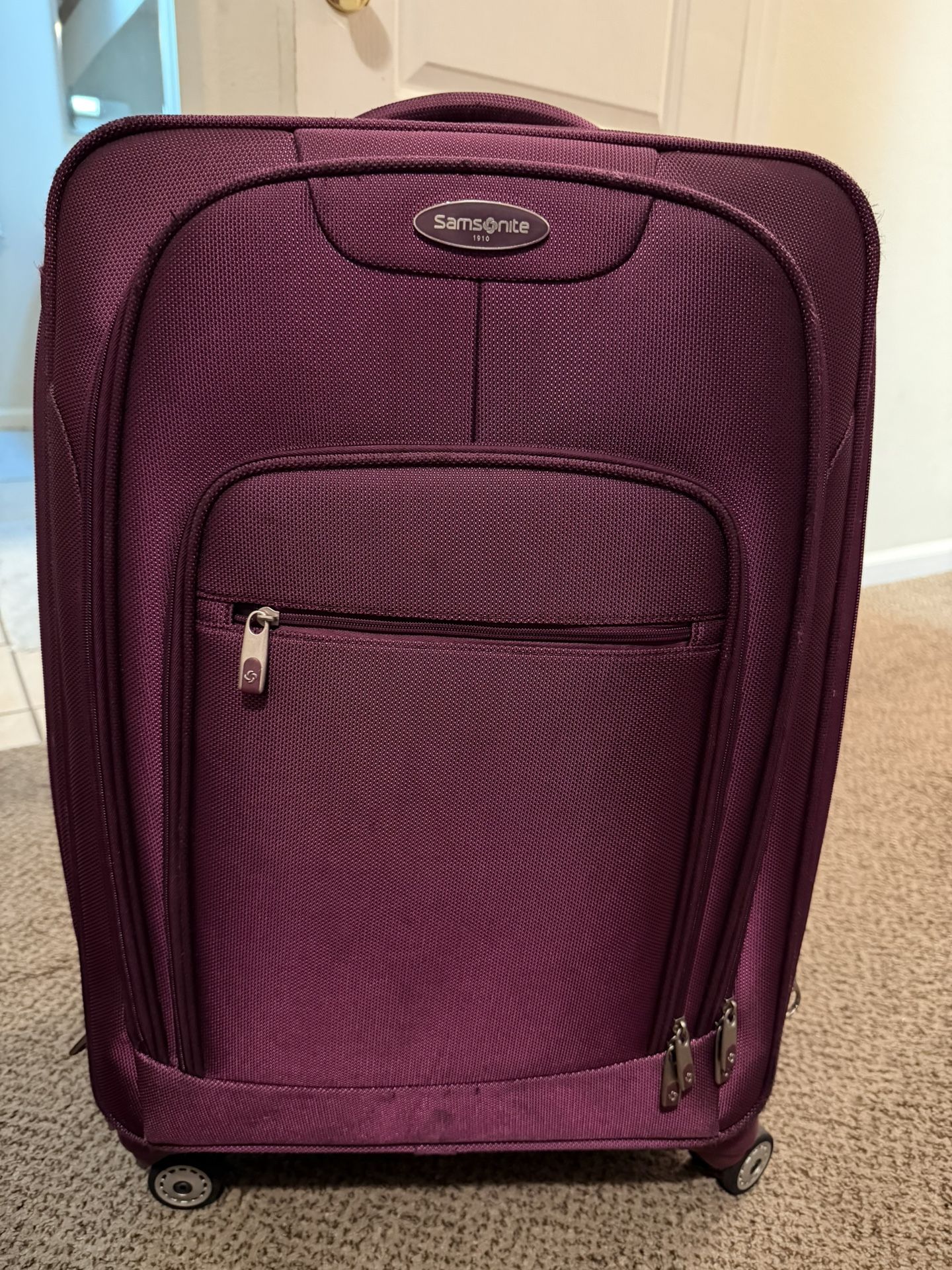 Used Purple Samsonite Luggage 