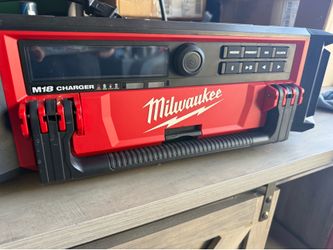 Milwaukee M-18- Lithium-Ion- Cordless- Packout radio speaker with built in charger