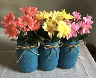 Distressed mason jar vases with silk flowers included! $13 for 3