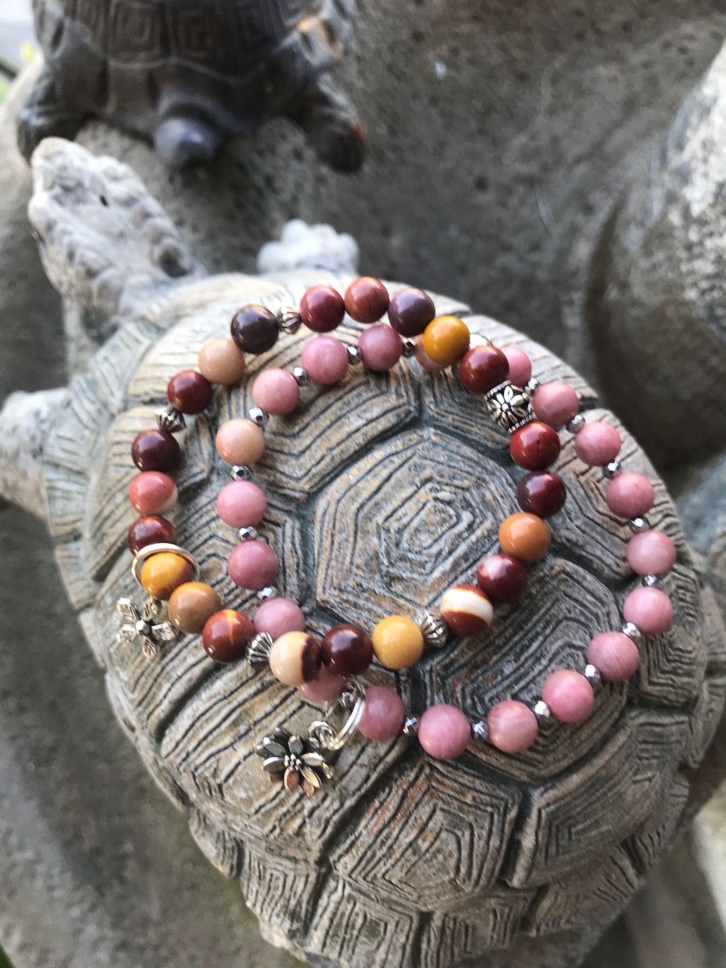 Jasper and rhodochrosite stretch bracelets with flowe charms. Size 7 inches