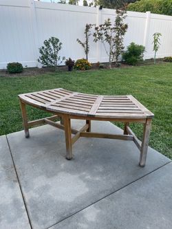 Curved wooden outdoor bench