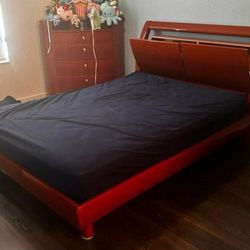 Set full-size brown wood bed frame with 2 storage cabinets on headboard and include 5 drawers wood cabinet