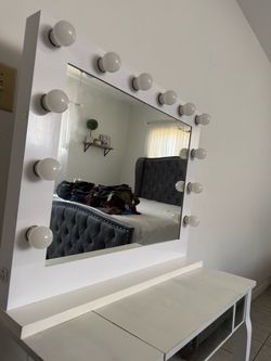 Vanity with outlet plug in