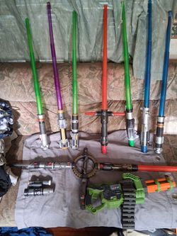 7 assorted star wars  Lightsabers and Dart Blaster ,