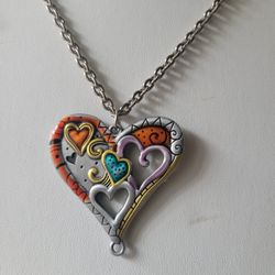 Large heart pendant and chain silver tone.  See all pics for more details 