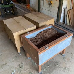 Potting soil and fertilizer storage cabinets on rollers