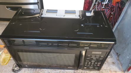 microwave GE black ober the range use great conditio 90 days warranty