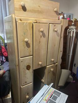 Twin bed w draws wooden and a bureau to match . Wooden .
