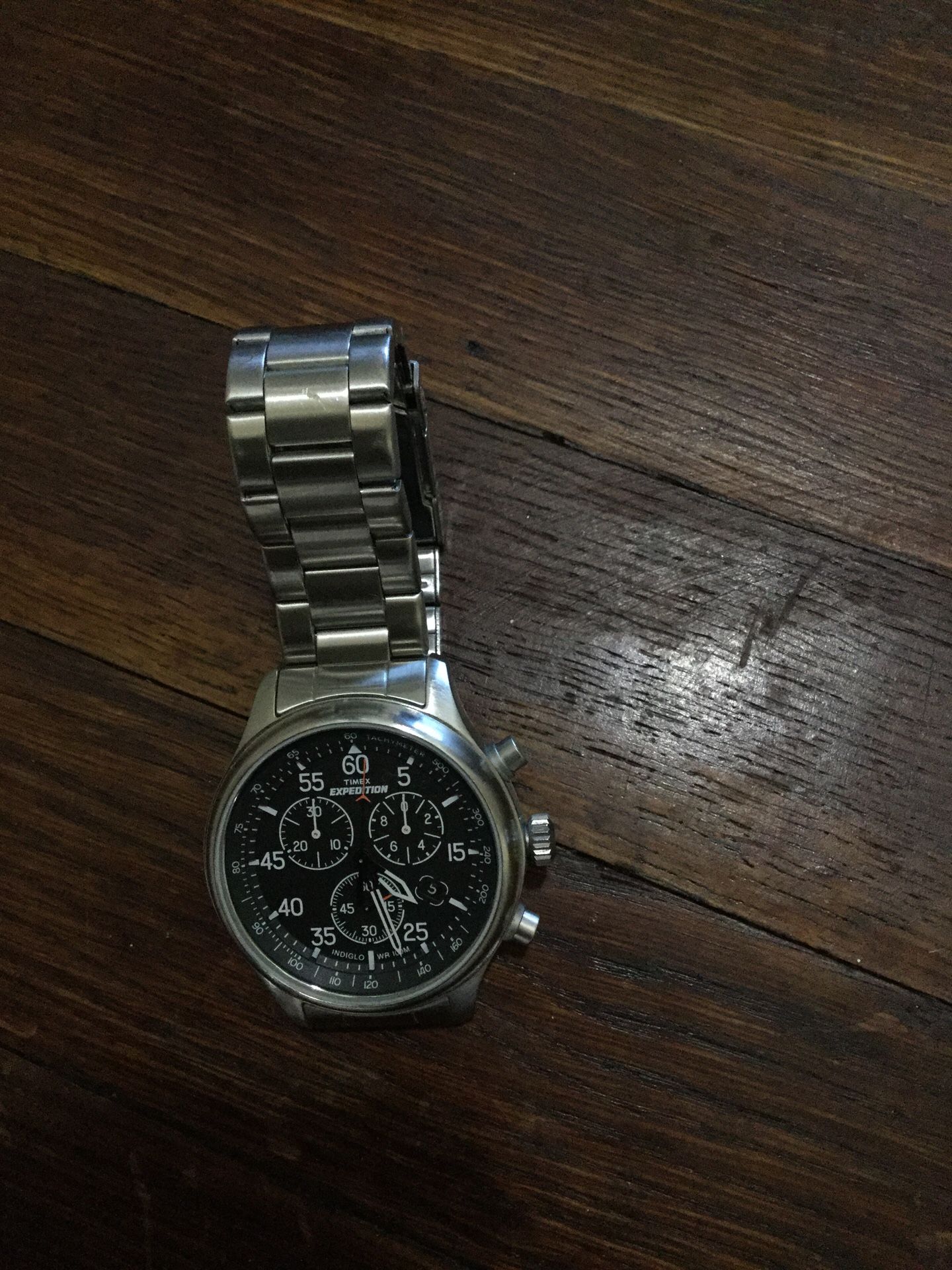 Round silver chronograph watch with link bracelet