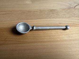 is a vintage pewter tasting spoon used for tasting wine or gourmet food. 